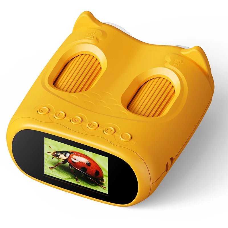 Yellow toy microcope with screen displaying a ladybug on a white background